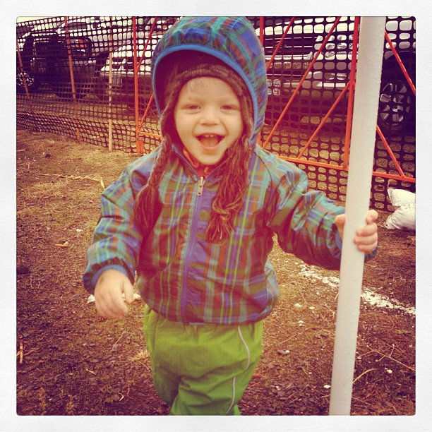 There are so many things I love about this photo. He was playing hide and seek behind tiny pole. Rain paint outfit cracks me up too. #mamajoy